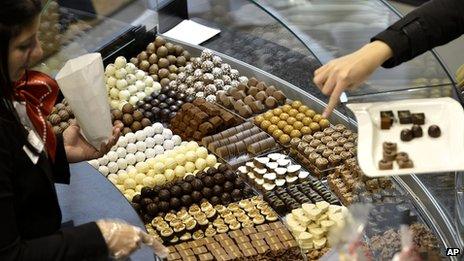 Visitors taste different sorts of chocolate at the International Salon des Chocolatiers et du Chocolat, in Geneva, Switzerland