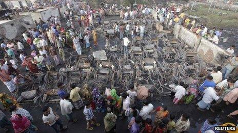 residents of the slum outside Dhaka mourn the dead