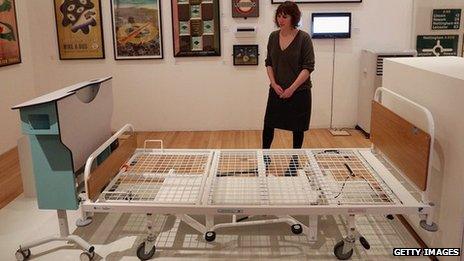 A woman views Kenneth Agnew's Prototype Kings' Fund Bed at the Royal College of Art