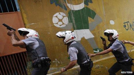 Policemen carrying out an operation in a slum in Sao Paulo