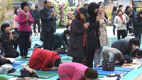 Praying for exam results in South Korea
