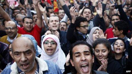 Protesters shout slogans against Mohammed Morsi's declaration in Cairo