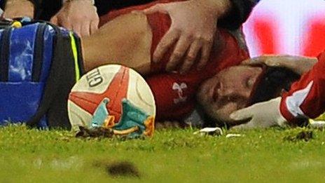 Leigh Halfpenny receives treatment on the field
