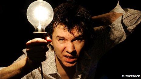 Man holding a light bulb