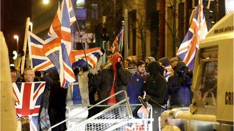 Reaction to loyalist violence over union flag issue - BBC News