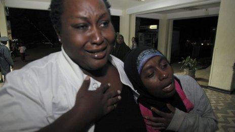 Relatives cry for their loved one as he is brought into hospital after an explosion in Nairobi, Kenya