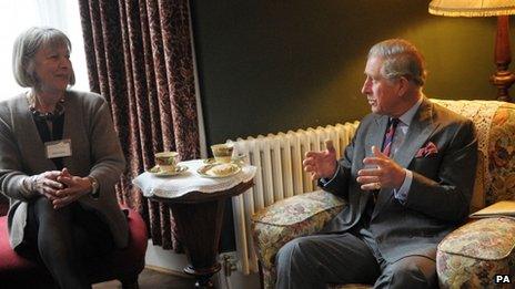 Prince Charles has tea in the living room of the birthplace of Dylan Thomas in Swansea with restorer of the house Anne Haden