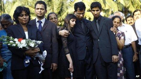 Jacintha Saldanha's family embrace at her burial