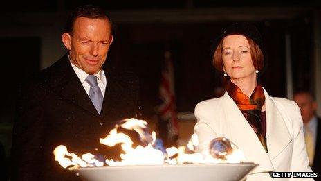 PM Julia Gillard (R) and opposition leader Tony Abbott (L) light a beacon to mark the Queen's jubilee on 4 June 2012