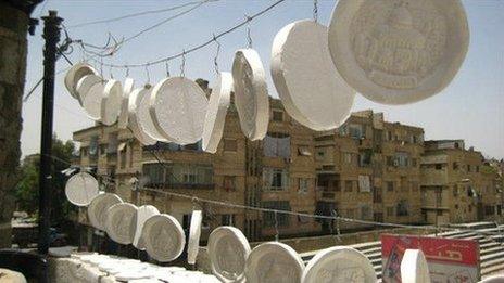 Memorial plaques with images of Jerusalem are made for Palestinian families in Yarmouk