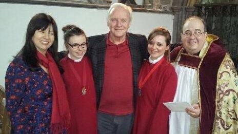 Sir Anthony Hopkins, pictured with his wife Stella Arroyave, the choristers and Canon Dorrien Davies