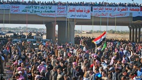 Sunni Iraqis pray during a demonstration calling for the release of prisoners they say were arrested on sectarian grounds in Ramadi, Anbar's provincial capital, on 28 December 2012