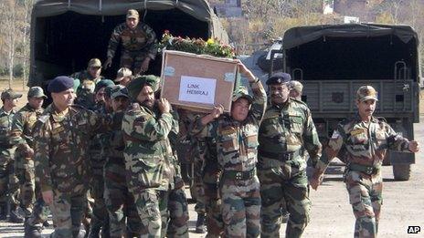 Indian army soldiers carry a coffin containing the body of a colleague who was allegedly killed by Pakistani soldiers