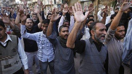Shia Muslim men shout slogans during a protest rally organised by the religious group Majlis-e- Wahdat-e-Muslimeen in Karachi, 11 January 2013