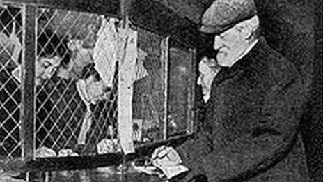 A man collects his first pension from a Post Office in January 1909