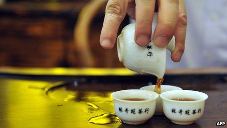 Hong Kong tea shop owner prepares Chinese tea the traditional way (2011 file picture)