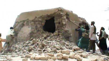 An archive image from July 2012 shows Islamist militants destroying an ancient shrine in Timbuktu