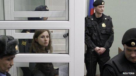 Maria Alyokhina, a member of the female punk band Pussy Riot, looks out from a defendants" box during a court hearing in Berezniki in Perm region, near the Ural mountains, 16 January 2013