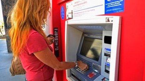 Woman at a cash machine