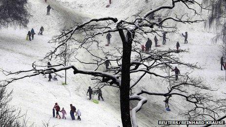 People enjoy the snow at Greenwich Park in London January 20, 2013