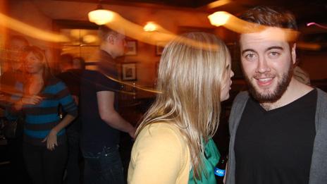 Jillian Rae Greenwood talking to a man at a nightclub in Ottawa, Canada
