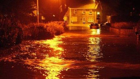 Floodwater on the road in Llanddowror