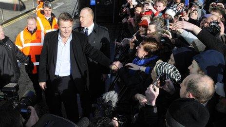 Liam Neeson arrives in Ballymena to receive award - BBC News