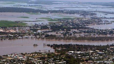 Rescuers help Australia flood victims as waters recede - BBC News