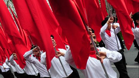 Protesters from outlawed leftist group DHKP-C march with red flags during a May Day rally in central Istanbul, on May 1, 2011