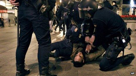 Police hold down a demonstrator in Madrid - 2 February