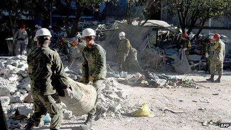 Mexican soldiers help clear debris. 4 Feb 2013
