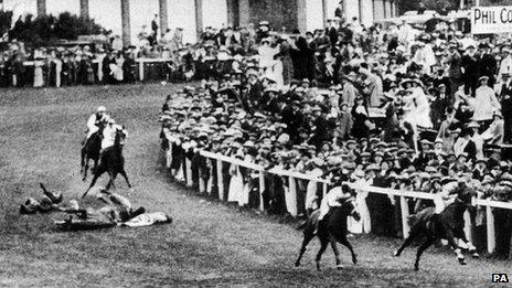 Suffragette Emily Davison throwing herself under a horse in 1913