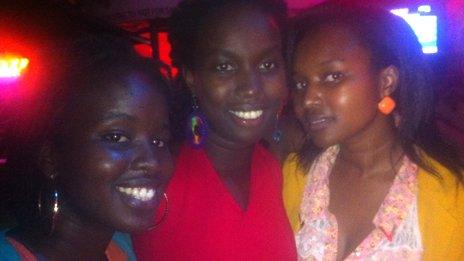 Jacky Kemisiga (L) and her friends on a night out