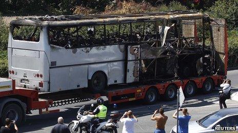 File photo of a truck carrying a bus damaged in a bomb blast outside Burgas airport in Bulgaria in July 2012