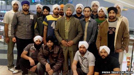 Surinder Pal Singh Oberoi with 17 Indian nationals he helped free