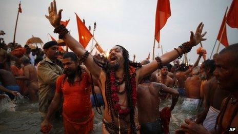 Naga Sadhus take ritual dips at Sangam on Basant Panchami in Allahabad on Friday, Feb 15, 2013.