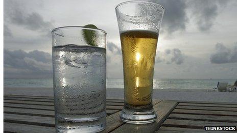 Beer and lemonade on a beachside table
