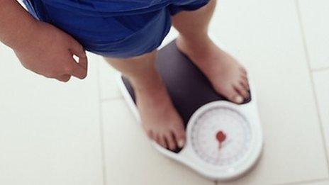 Man using weighing scales