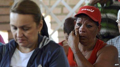 Supporters of Venezuelan President Hugo Chavez cry during prayers at the chapel inside the Military Hospital in Caracas