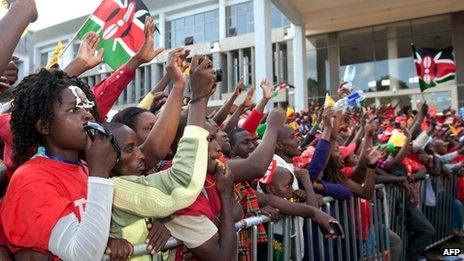 Supporters of Kenyan presidential candidate Uhuru Kenyatta celebrate at the Catholic University where Uhuru Kenyatta gave the acceptance speech of his victory in Kenya"s national elections on March 9, 2013 in Nairobi.