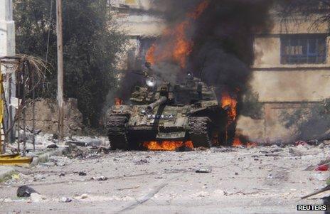A tank burns in Daraa, Syria, 9 March