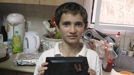 Ari Zivotofsky's son Menachem with some chocolate-covered locust