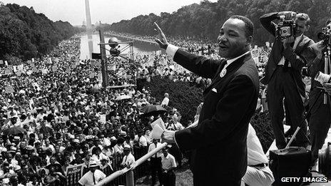 Civil rights leader Martin Luther King waves to supporters on the Mall in Washington, DC 28 August 1963