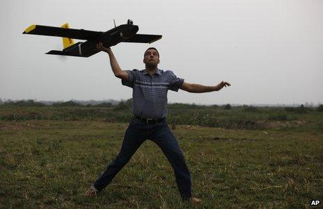 Remo Peduzzi, managing director of ResearchDrones LLC Switzerland, prepares to fly a drone at the Kaziranga National Park at Kaziranga in Assam state, India, 8 April