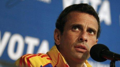 Venezuela"s opposition leader and presidential candidate Henrique Capriles attends a news conference in Caracas