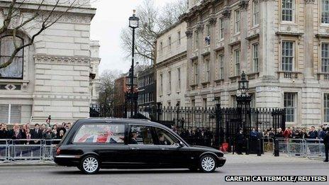 The hearse carrying the coffin of former British prime minister Margaret Thatcher makes its way past Downing Street