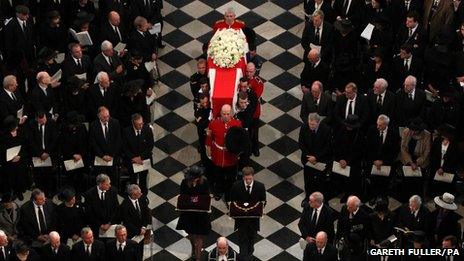 The funeral service at St Paul's Cathedral begins with Baroness Thatcher's coffin being borne through the vast structure by eight military personnel