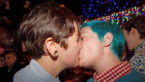 Gay rights supporters celebrate in a bar in Wellington on 17 April