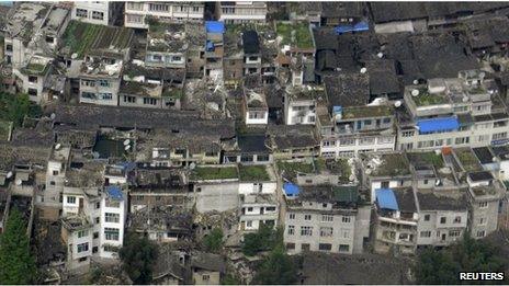 An aerial view shows houses damaged after a strong earthquake in Lushan county, April 20, 2013