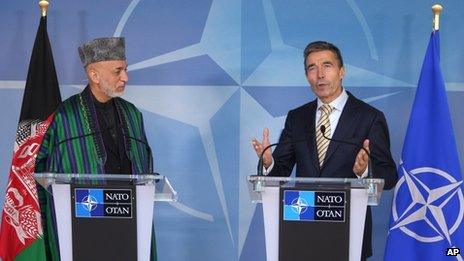 Nato Secretary General Anders Fogh Rasmussen, right, and Afghan President Hamid Karzai at a press conference at Nato headquarters in Brussels, 23 April 2013